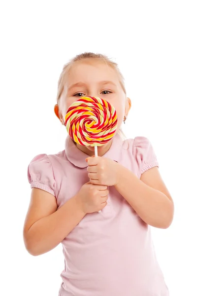 Little girl with a large lollipop. — Stock Photo, Image