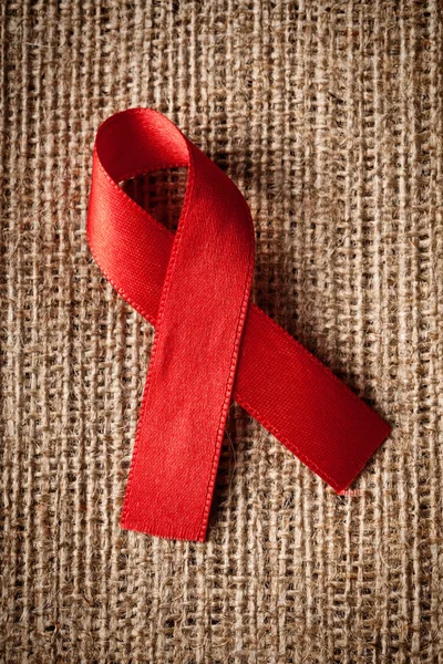Red ribbon aids awareness — Stock Photo, Image