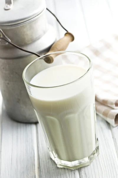 Glass of milk on wooden table — Stock Photo, Image