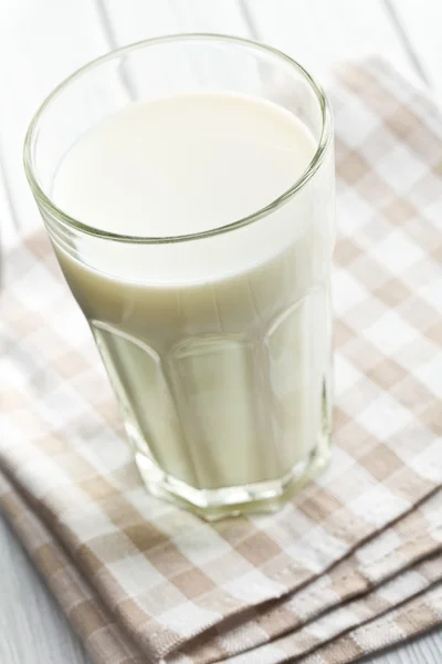 Glass of milk on wooden table — Stock Photo, Image