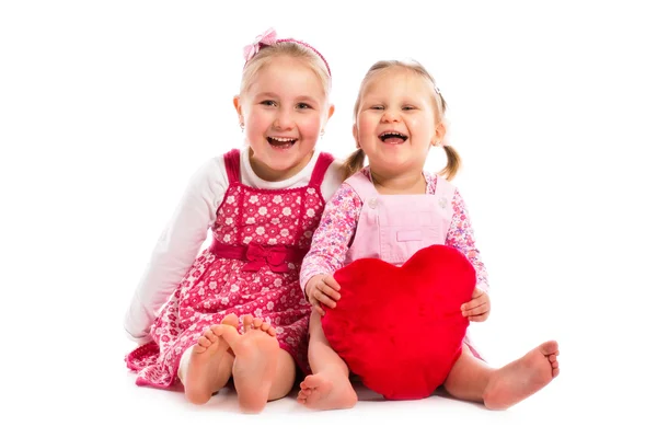 Two sisters with heart — Stock Photo, Image