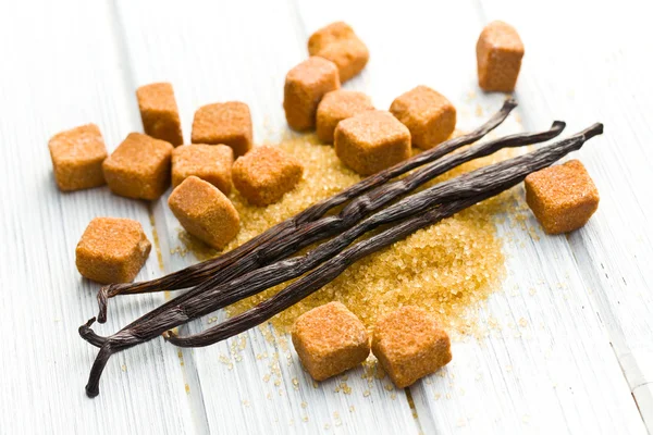 Vanilla pods with brown sugar — Stock Photo, Image