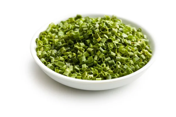 Sliced green chives in ceramic bowl — Stock Photo, Image