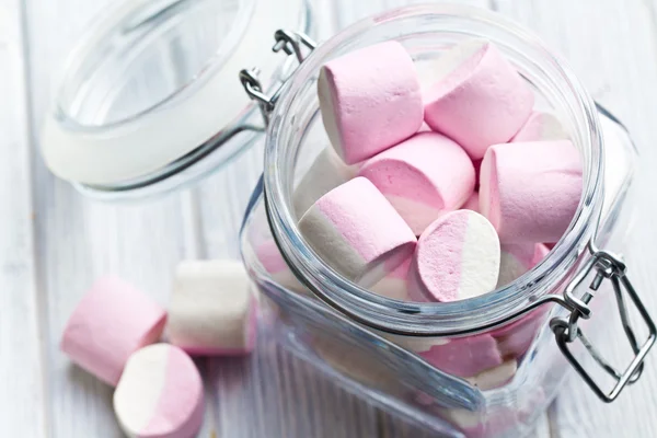 Sweet marshmallows in glass jar — Stock Photo, Image