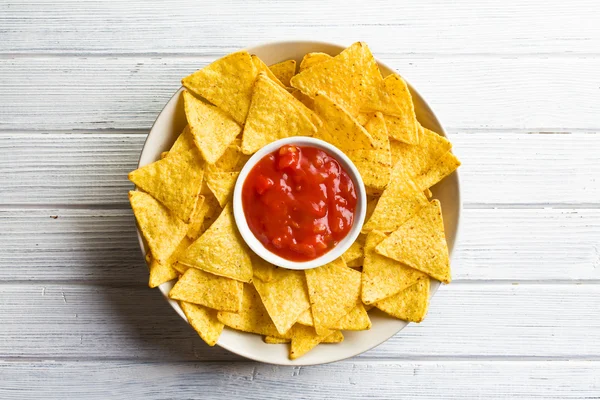 Corn nachos with tomato dip — Stock Photo, Image