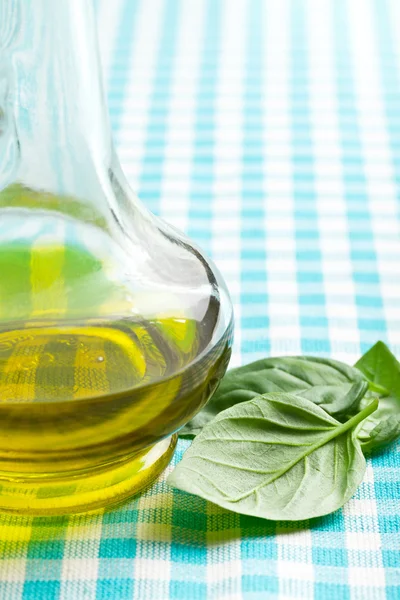 Basil leaves and olive oil — Stock Photo, Image