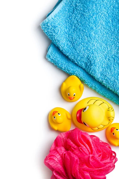 Yellow bath ducks and bath puff — Stock Photo, Image