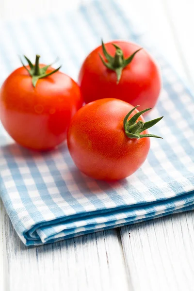 Red tomatoes on napkin — Stock Photo, Image