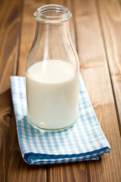 Milk in glass jar on napkin — Stock Photo, Image