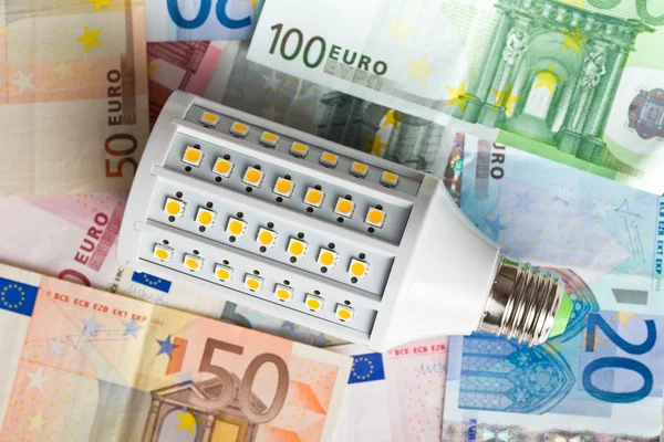 LED lightbulb with euro money — Stock Photo, Image