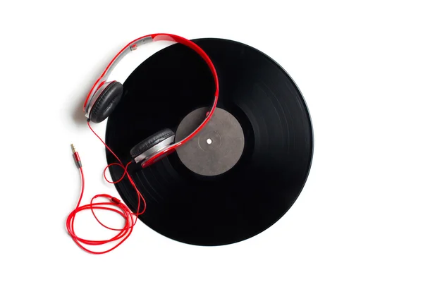Red headphones with vinyl album — Stock Photo, Image