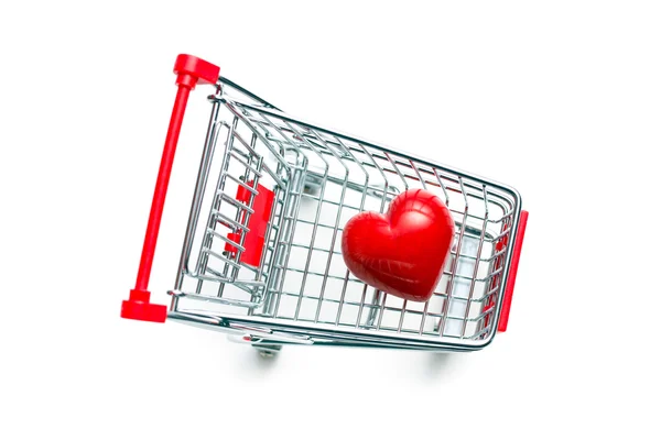 Corazón de piedra en el carrito de compras —  Fotos de Stock