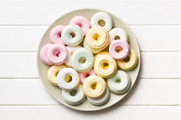 Colorful meringues on plate — Stock Photo, Image