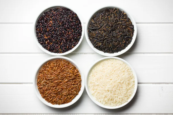 Various rice in ceramic bowls — Stock Photo, Image