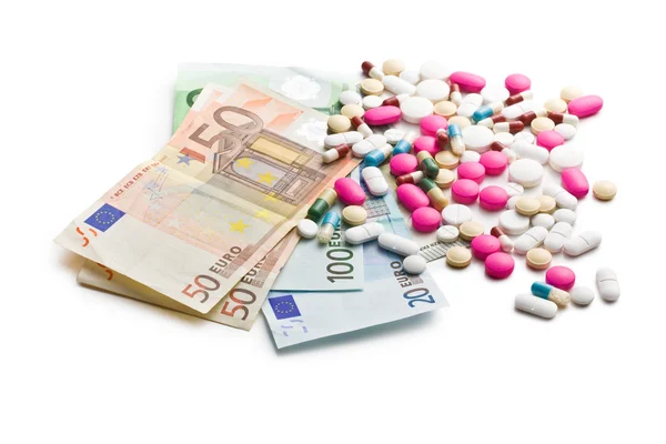 Colorful pills with euro bills — Stock Photo, Image