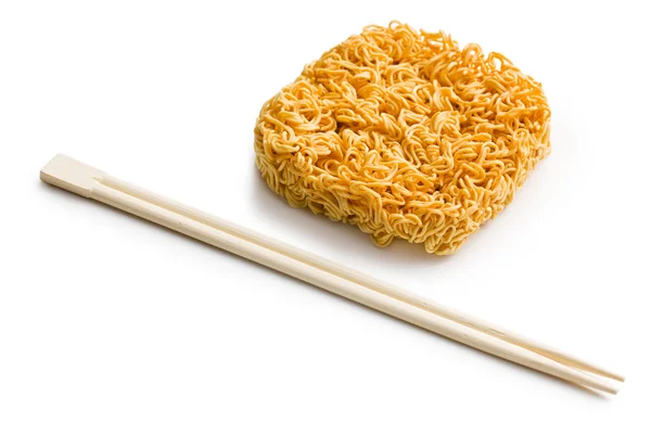 Dried chinese noodles with chopsticks — ストック写真