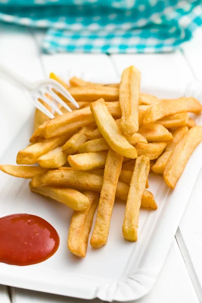 French fries with ketchup on paper plate — Stock Photo, Image