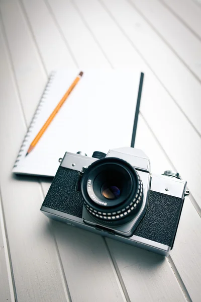 Retro camera with notebook — Stock Photo, Image