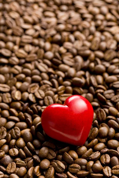Heart of stone on coffee beans — Stock Photo, Image