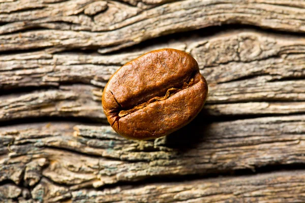 Coffee bean na dřevěné pozadí — Stock fotografie