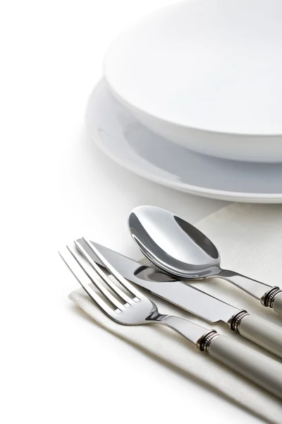Silver cutlery and plates — Stock Photo, Image