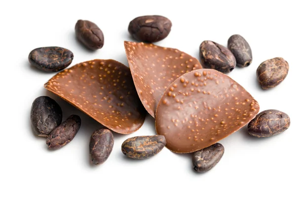 Chocolate chips with cocoa beans — Stock Photo, Image