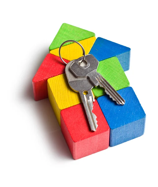 House made from wooden toy blocks with keys — Stock Photo, Image