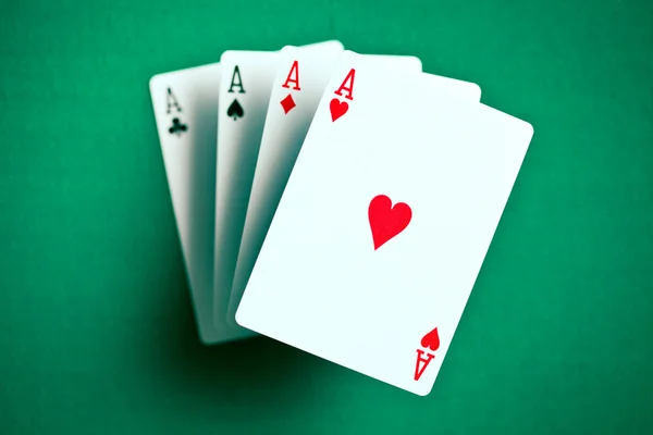 Four aces on green casino table — Stock Photo, Image