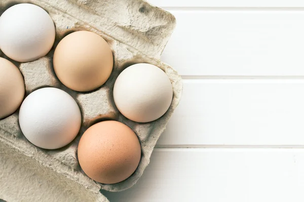 Chicken eggs in egg box — Stock Photo, Image