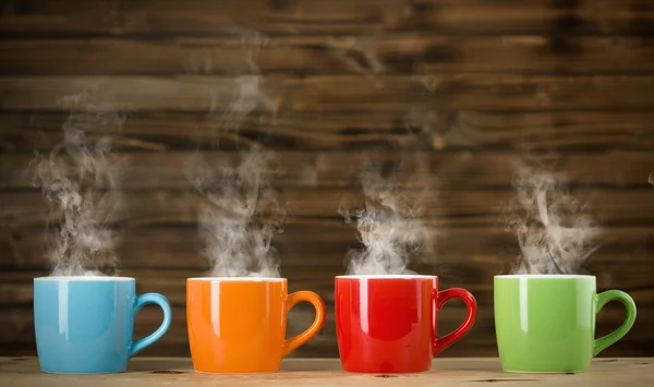 Cups with steaming drink — Stock Photo, Image