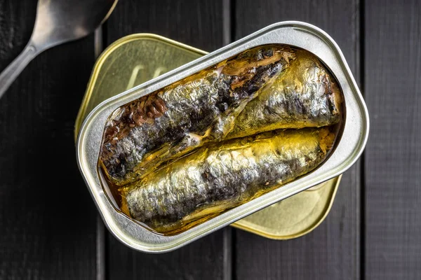 Canned Sardines Sea Fish Tin Can Black Table Top View — Stock Photo, Image