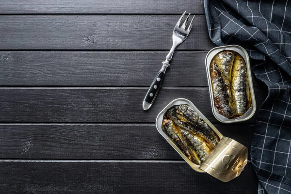 Canned Sardines Sea Fish Tin Can Black Table Top View — Stock Photo, Image