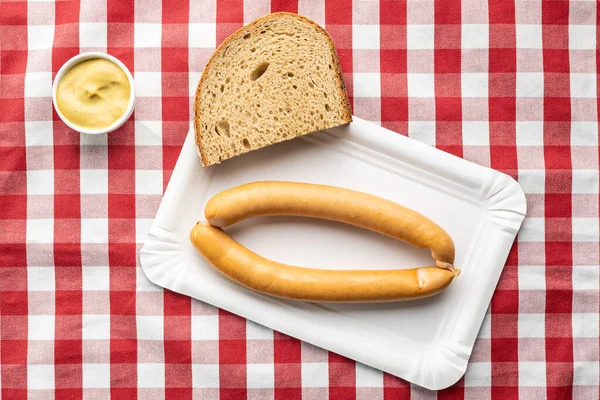 Smoked Frankfurter Sausages Paper Plate Checkered Tablecloth Top View — Stock Photo, Image