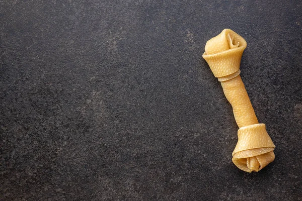 Delicacy Dogs Chewing Bone Dog Black Table Top View — Stock Photo, Image