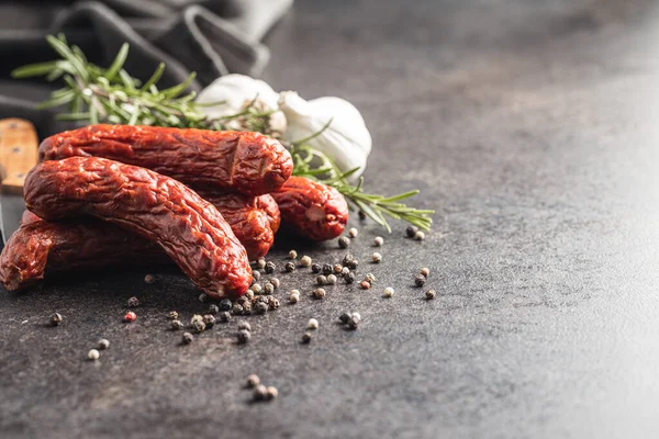 Smoked Sausages Pepper Rosemary Garlic Black Table — Foto Stock
