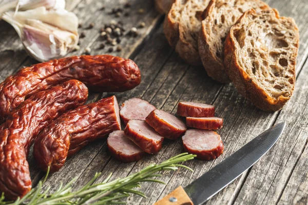 Smoked Pork Sausages Sliced Salami Wooden Table — стоковое фото