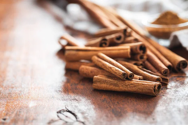 Dry cinnamon sticks on a wooden table. Cinnamon spice.