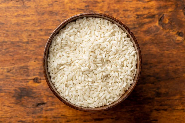 Uncooked Carnaroli Risotto Rice Bowl Wooden Table Top View — Stock Photo, Image