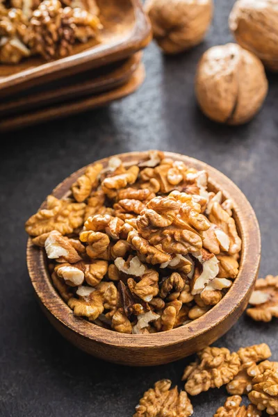 Peeled Walnut Kernels Wooden Bowl Black Table — стоковое фото