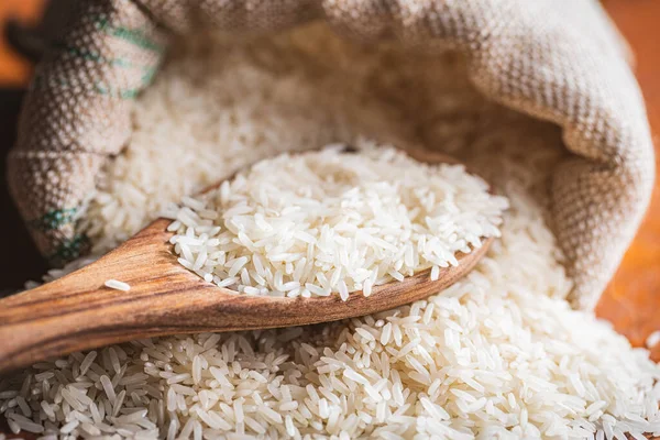 Uncooked White Rice Wooden Spoon — ストック写真