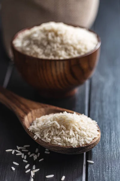 Uncooked White Rice Wooden Spoon Black Table — Stockfoto