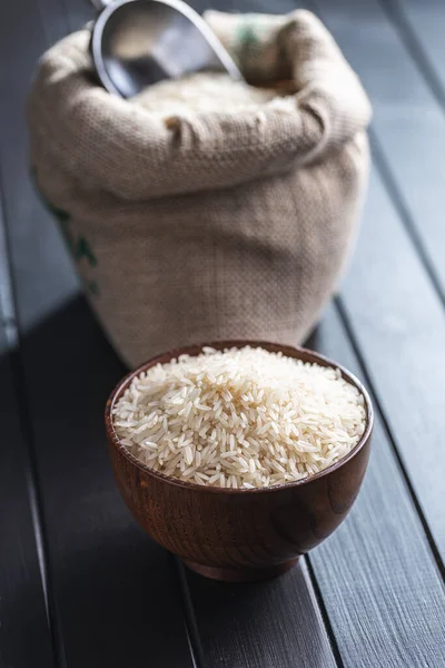 Uncooked White Rice Wooden Bowl Black Table Jogdíjmentes Stock Képek