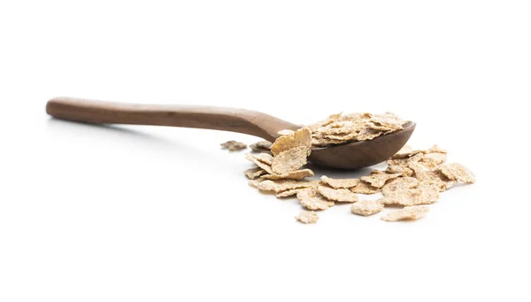 Whole Grain Cereal Flakes Wooden Spoon Wholegrain Breakfast Cereals Isolated lizenzfreie Stockbilder