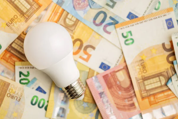 Light Bulb Euro Money Concept Increasing Electricity Prices Top View — ストック写真
