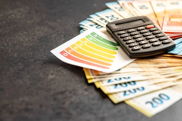 Energetic Label Euro Money Calculator Black Table —  Fotos de Stock