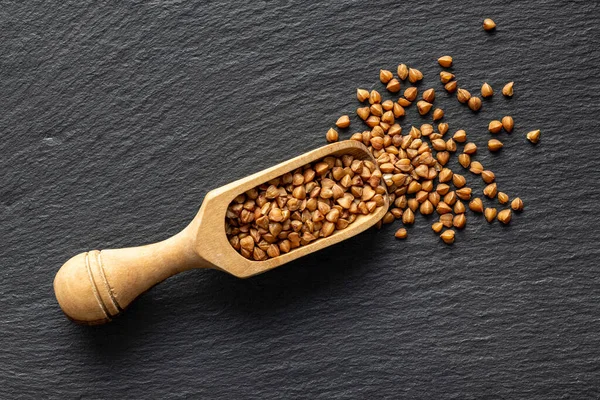 Uncooked Buckwheat Grain Wooden Scoop Top View — Stok fotoğraf