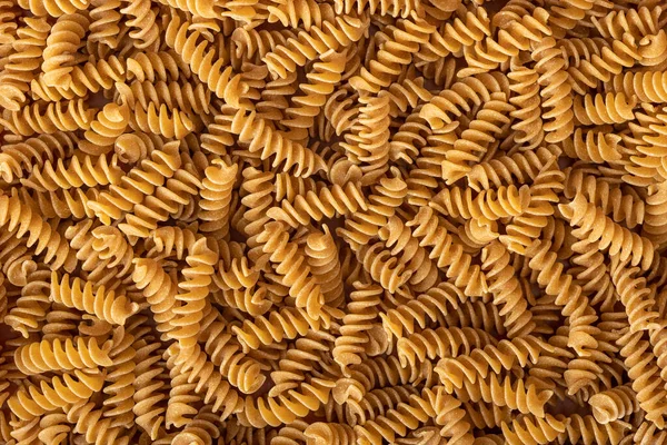 Uncooked Whole Grain Pasta Raw Spindle Pasta Top View — Stock Photo, Image