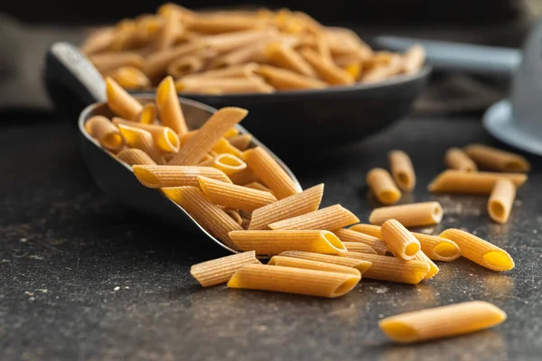 Uncooked Whole Grain Pasta Raw Penne Pasta Scoop — Stock Photo, Image