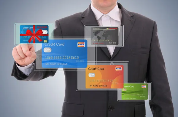 Businessman selecting a credit card — Stock Photo, Image