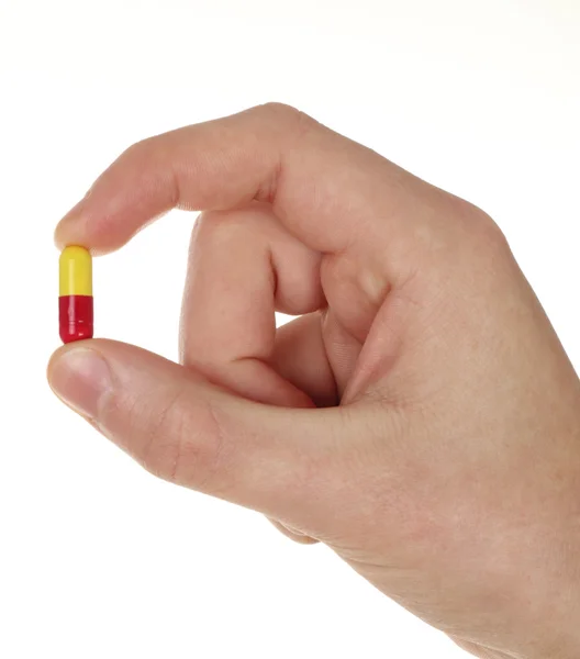 Hand und Pille isoliert auf weißem Hintergrund — Stockfoto